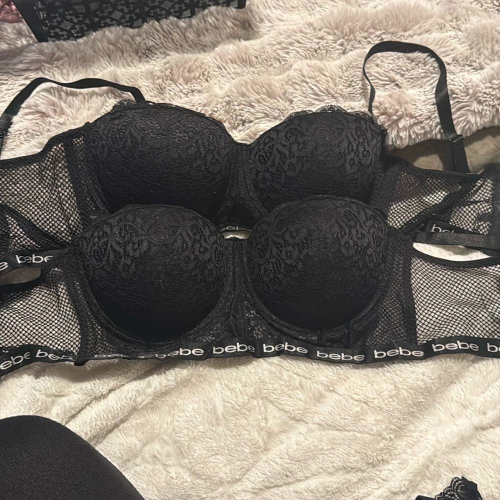 2 black Bebe bras never worn. Size 38C and 38D